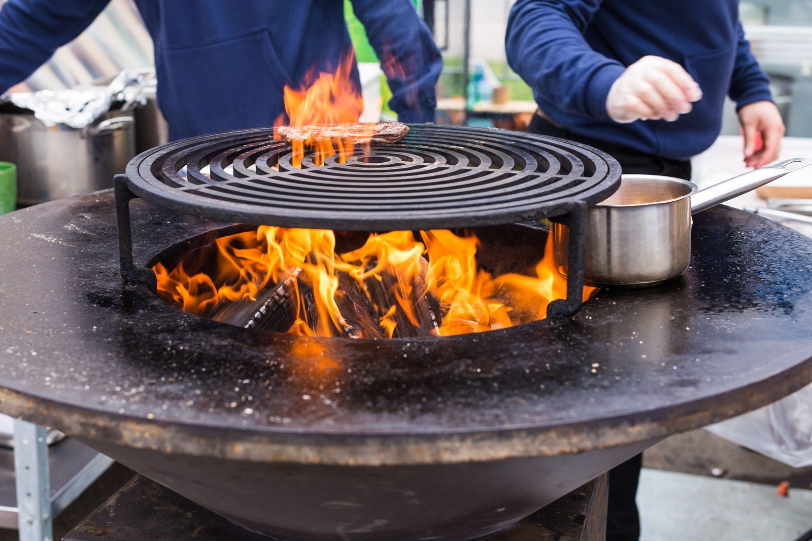 Guests enjoying a hibachi catering Panama City Beach FL experience with live cooking and entertainment at a beach house