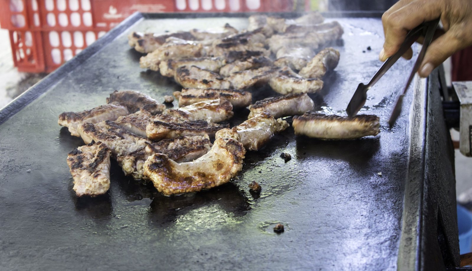 A private hibachi chef setting up a grill for a hibachi at home experience in Destin Florida