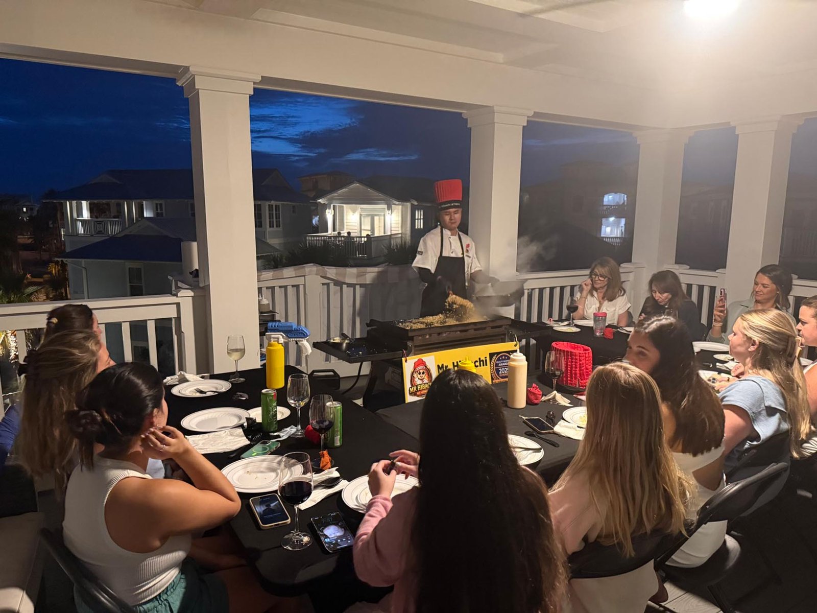 A private hibachi chef prepares dinner at a luxury vacation rental along 30A.