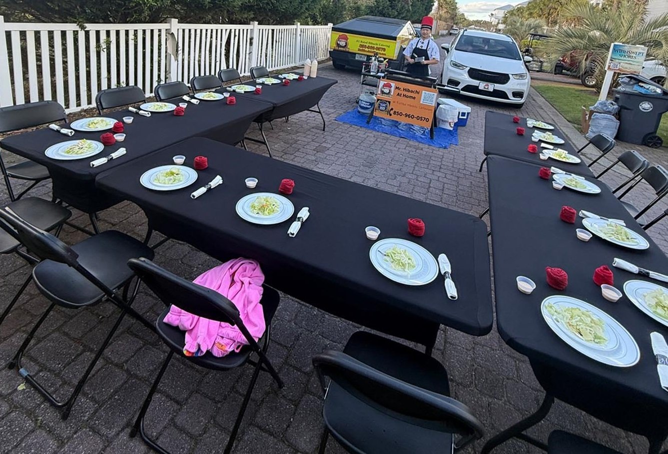 A private hibachi chef entertains wedding guests during a welcome party in 30A.
