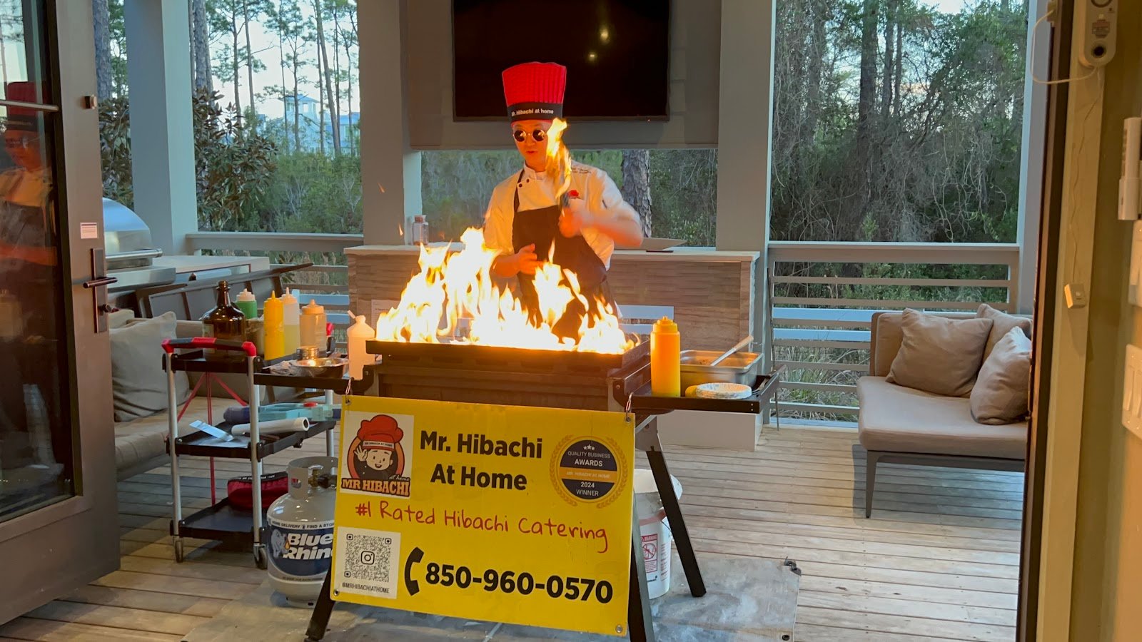 Private chef cooking a flaming hibachi dish for a Christmas dinner celebration