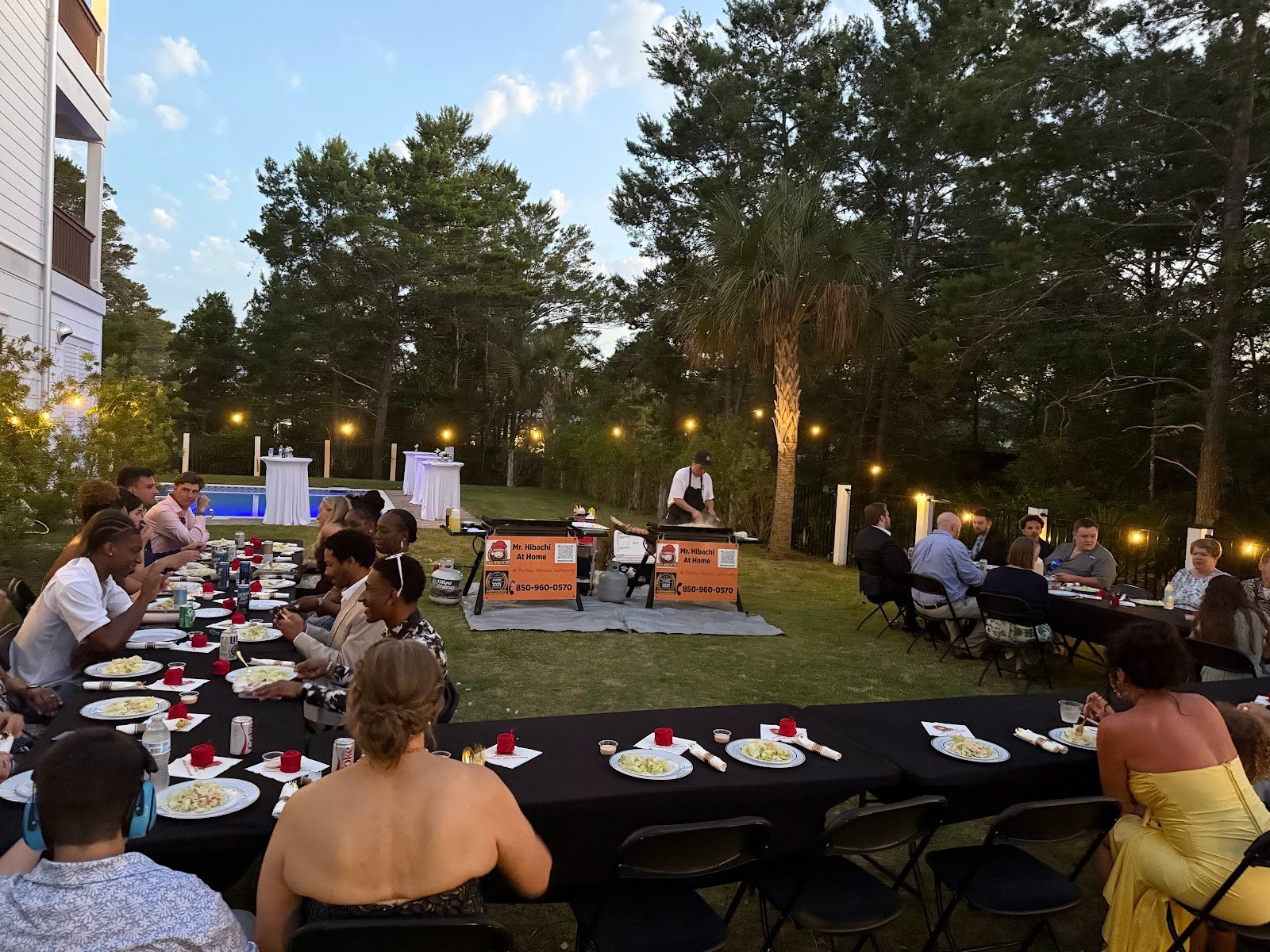 Large group holiday party catering setup with formal dinner tables in Florida