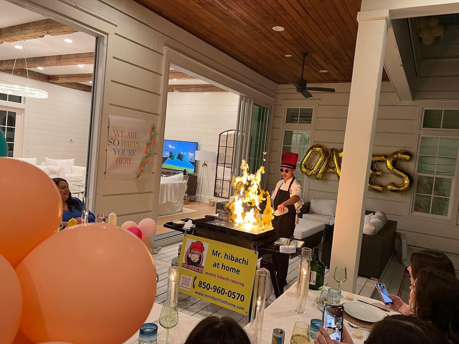 Balloons and hibachi chef celebrating a milestone birthday party in Alys Beach