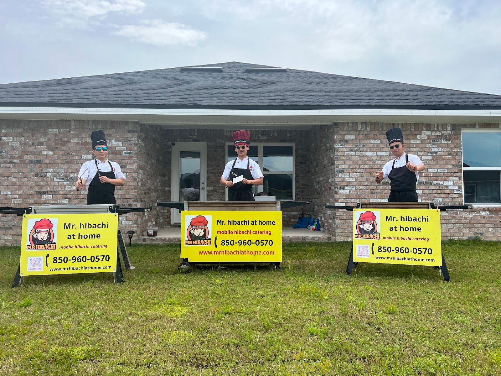 Three mobile hibachi catering teams set up side by side for large group events on the Emerald Coast